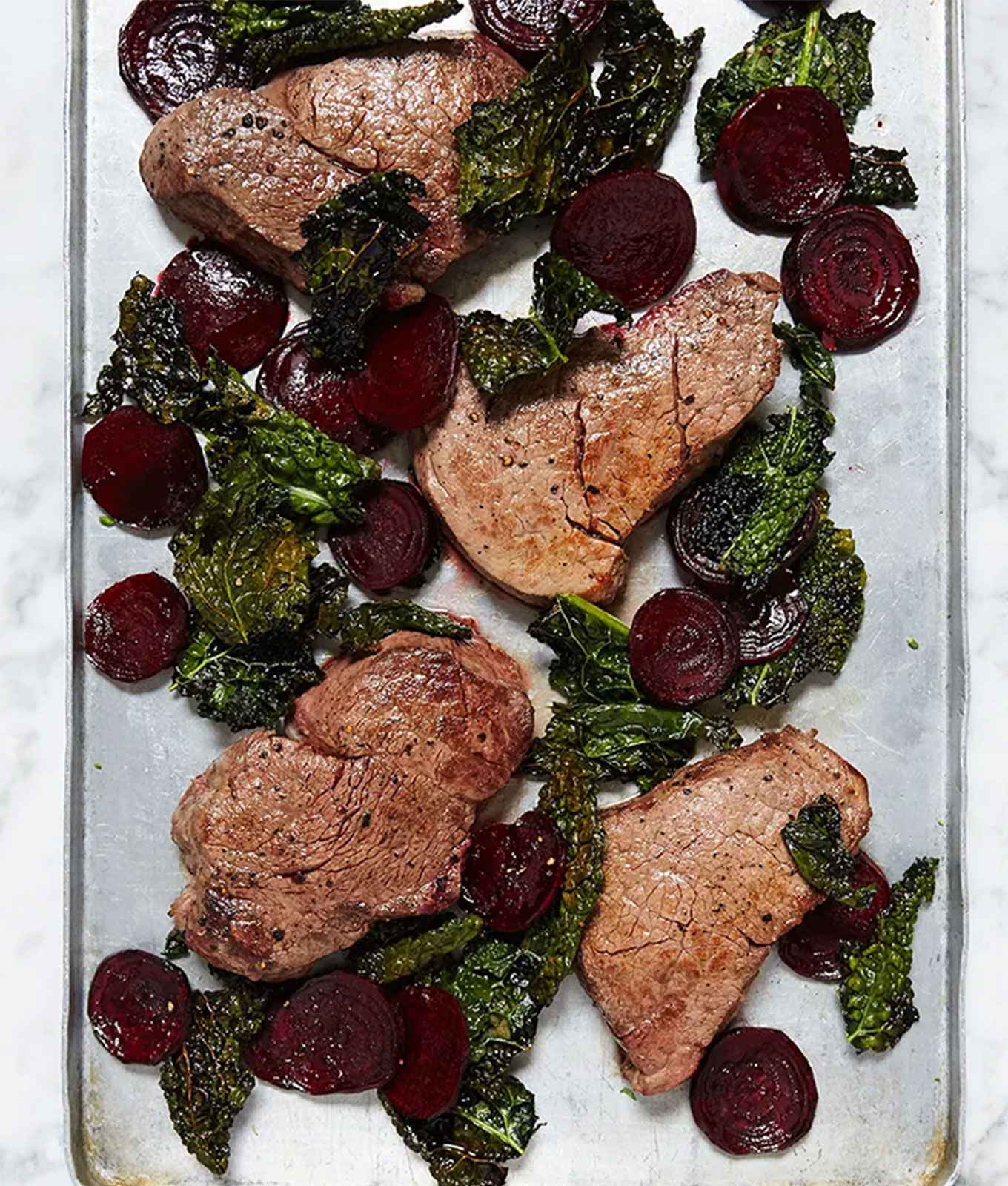 paleo meal plan recipes: one-pan steak with beets and crispy kale