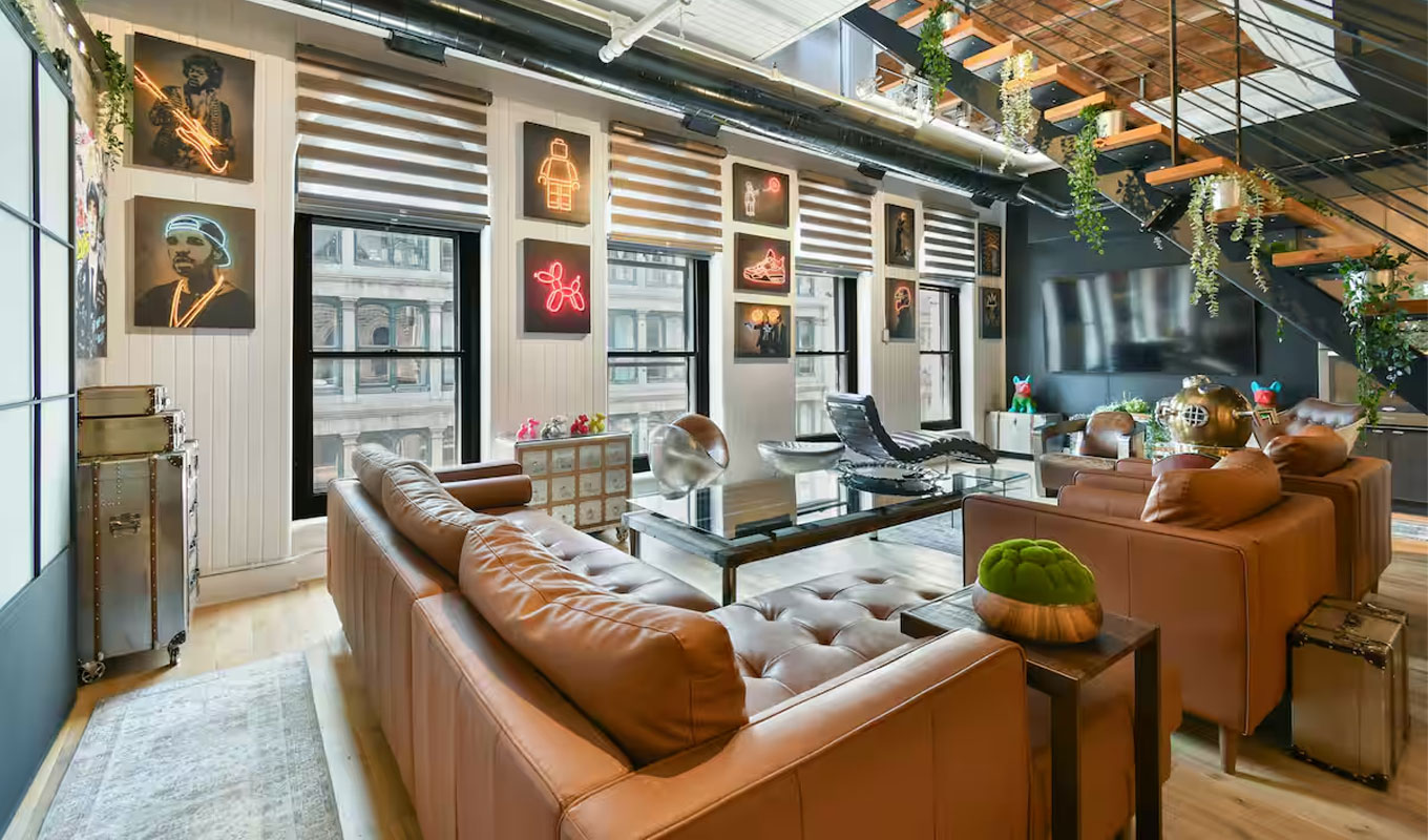 kid-friendly-airbnb-rental: A modern, yet retro apartment living room with lots of wall decor.