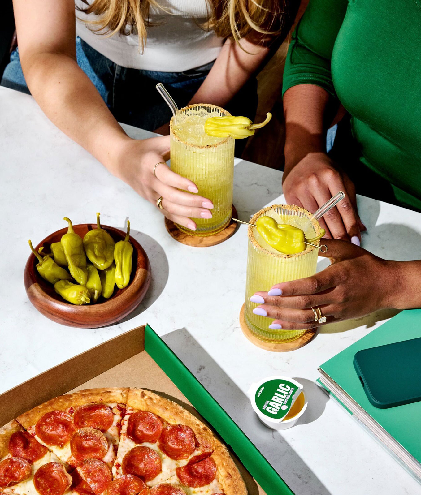 papa john's 'cini dirty soda: two people drinking papa john's 'cini dirty soda with pizza and more pepperoncini